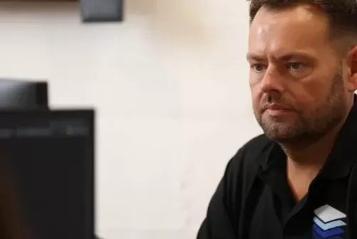 Staff working on monitor